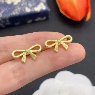 Boucles d'oreilles Dior Bow en ton or avec logo gravé