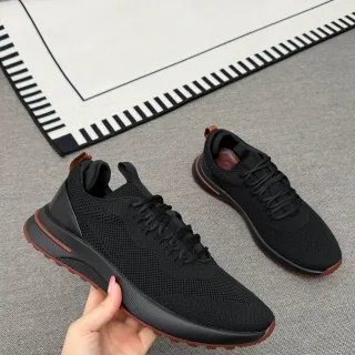 Tênis pretos e marrons com upper em malha tricot, midsole monolítica esculpida