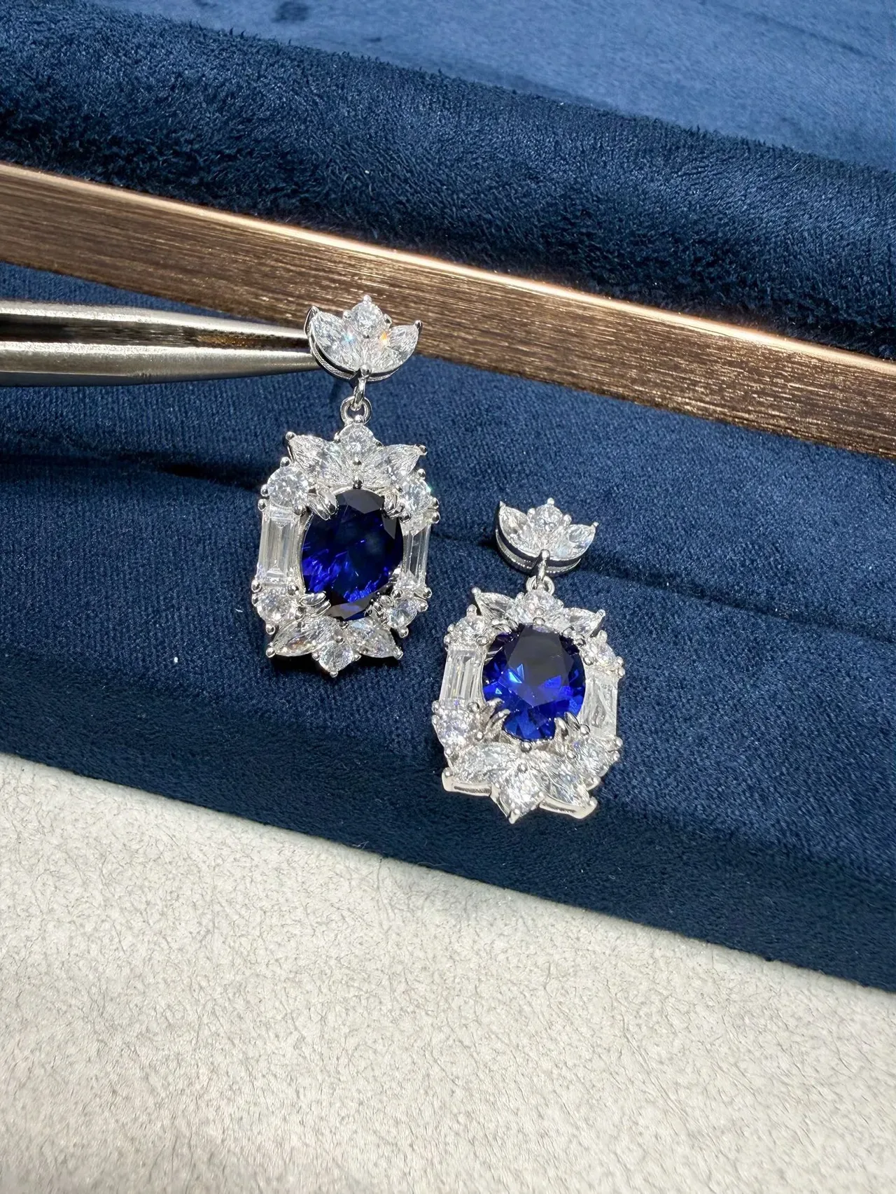 Ornate Floral Motif Oval Blue Gemstone and Clear Stone Dangling Earrings 4