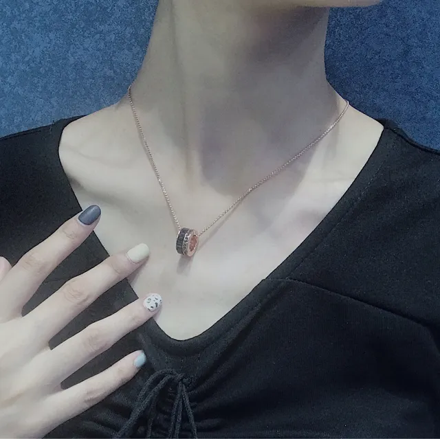 Rose Gold-Tone Rotating Black Ring Pendant Necklace 2