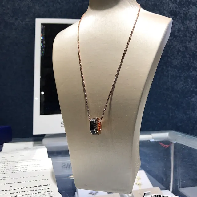 Rose Gold-Tone Rotating Black Ring Pendant Necklace 4