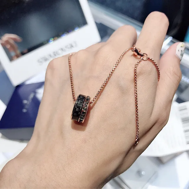 Rose Gold-Tone Rotating Black Ring Pendant Necklace 5