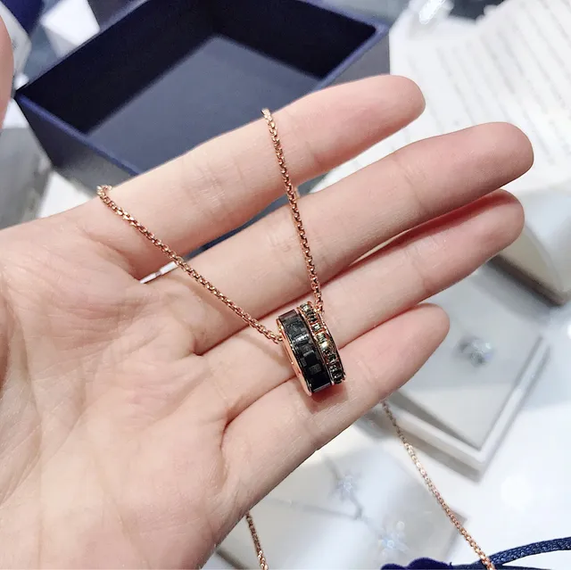 Rose Gold-Tone Rotating Black Ring Pendant Necklace 7