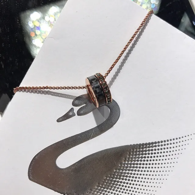 Rose Gold-Tone Rotating Black Ring Pendant Necklace 9