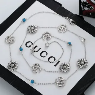 Gucci Multi-Charm Daisy and GG Logo Silver-Tone Necklace