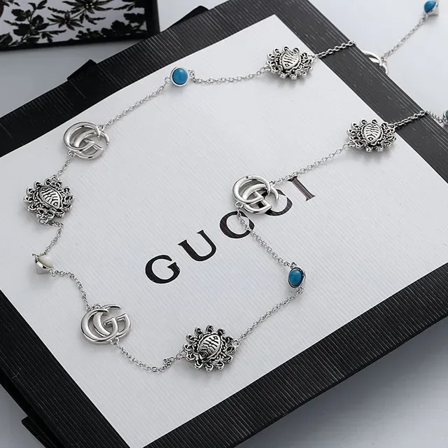 Gucci Multi-Charm Daisy and GG Logo Silver-Tone Necklace 3