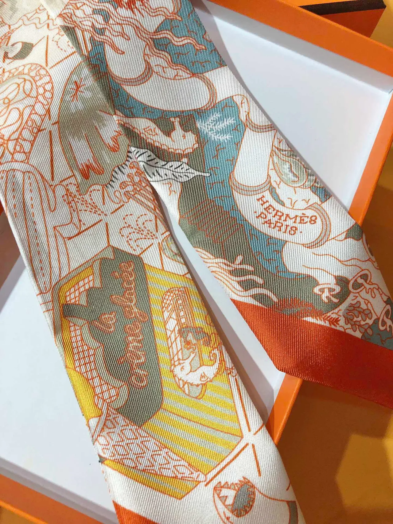 Hermès Printed Orange-Bordered Silk Scarf 8