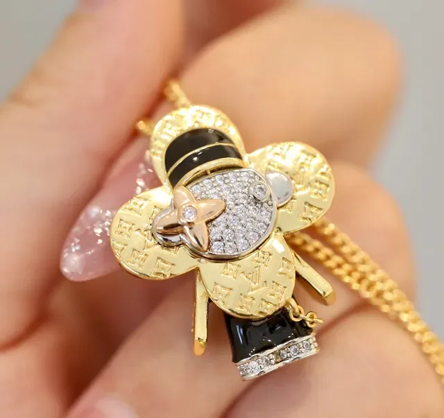 Louis Vuitton Gold Black Monogram-Engraved Pavé-Crystal Face Necklace 2