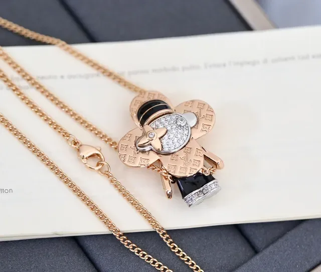 Louis Vuitton Gold Black Monogram-Engraved Pavé-Crystal Face Necklace 4
