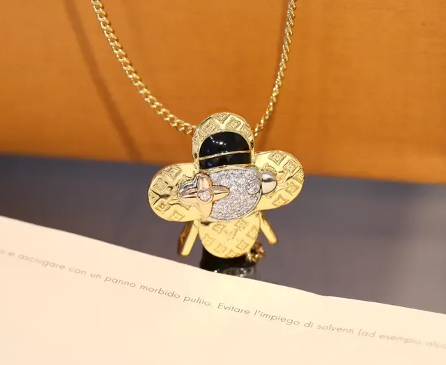 Louis Vuitton Gold Black Monogram-Engraved Pavé-Crystal Face Necklace 6