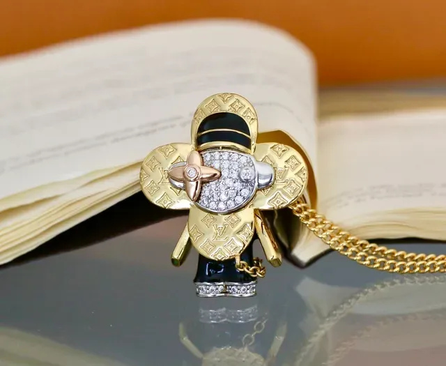 Louis Vuitton Gold Black Monogram-Engraved Pavé-Crystal Face Necklace 8