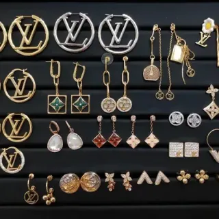 Louis Vuitton Gold Silver Monogrammed Metallic Earrings