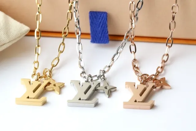 Louis Vuitton LV Monogram and Flower Charm Gold-Tone Chain Necklace 6