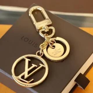 Louis Vuitton LV Monogram llavero dorado marrón metal pulido pulsera entrelazada