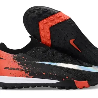 Nike Zapatillas de fútbol negro y naranja con upper de knit y suela turf