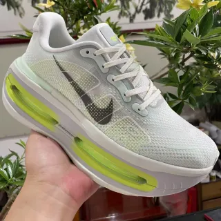Nike Chaussures de course avec upper en maille blanc et vert, unité d'air translucide néon