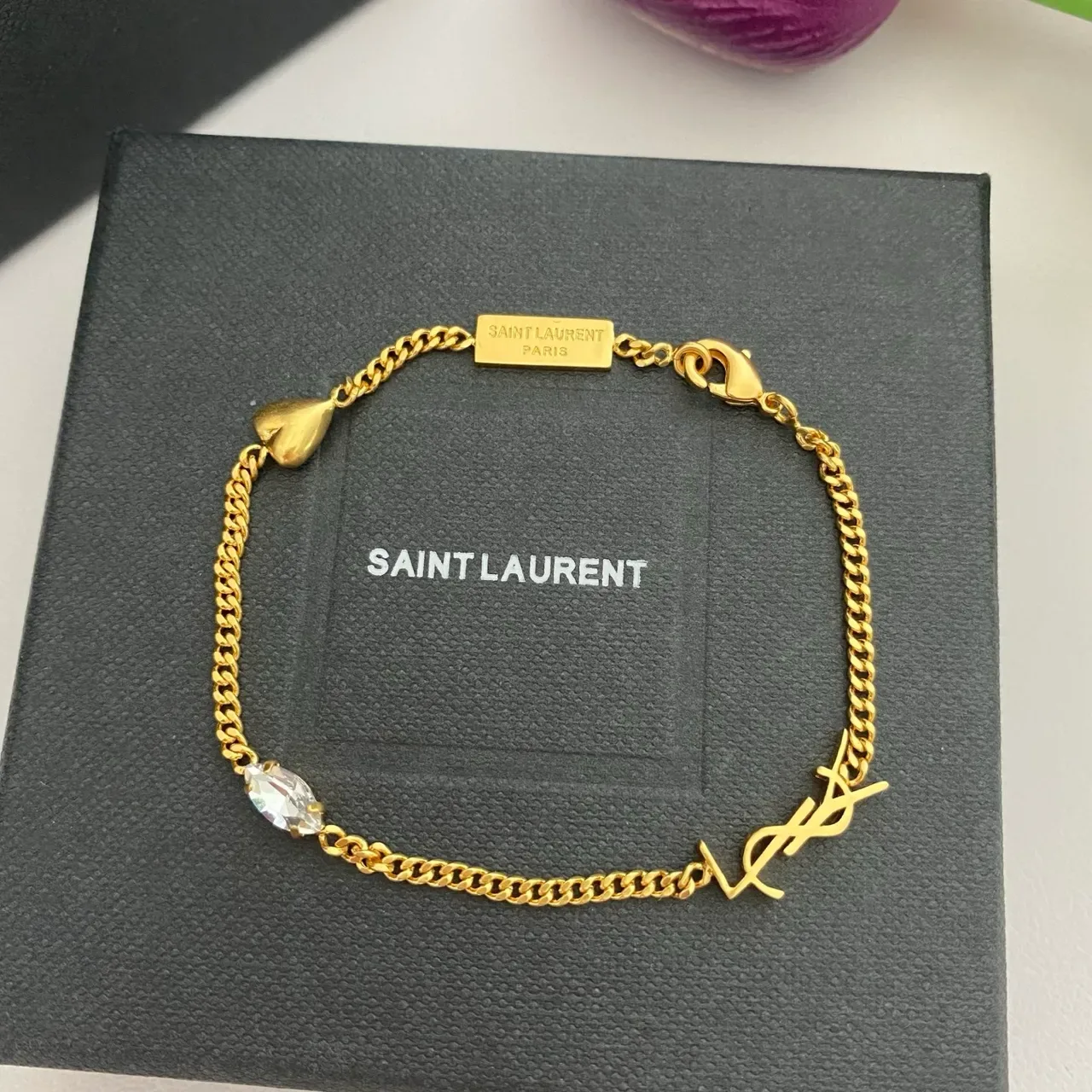 سوارة سلسلة Saint Laurent Monogram فضي ذهبي كارم 7