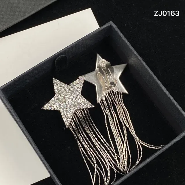 Saint Laurent Boucles d'oreilles cristal pavé chaîne franges étoile 5