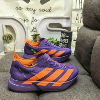 Adidas zapatillas moradas y naranjas para correr