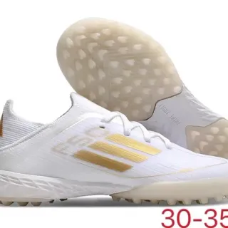 Adidas सफेद स्वर्ण किनिट अपर स्ट्राइप डिटेलिंग टर्फ फुटबॉल जूते