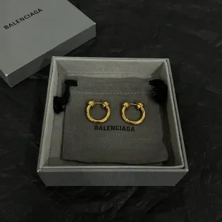 Balenciaga Aretes de aro dorados negros