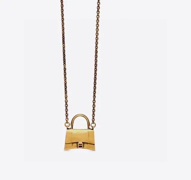 Collier Balenciaga Le Cagole Miniature Sac à Main Doré en Métal Structuré 9