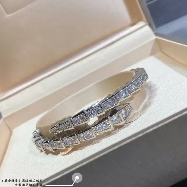 Bvlgari Serpenti Bracelet Argent et Or Maillons Articulés Géométriques et Pierres Pavé 2