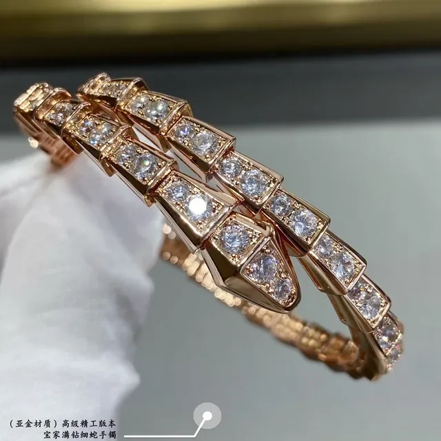 Bvlgari Serpenti Bracelet Argent et Or Maillons Articulés Géométriques et Pierres Pavé 7