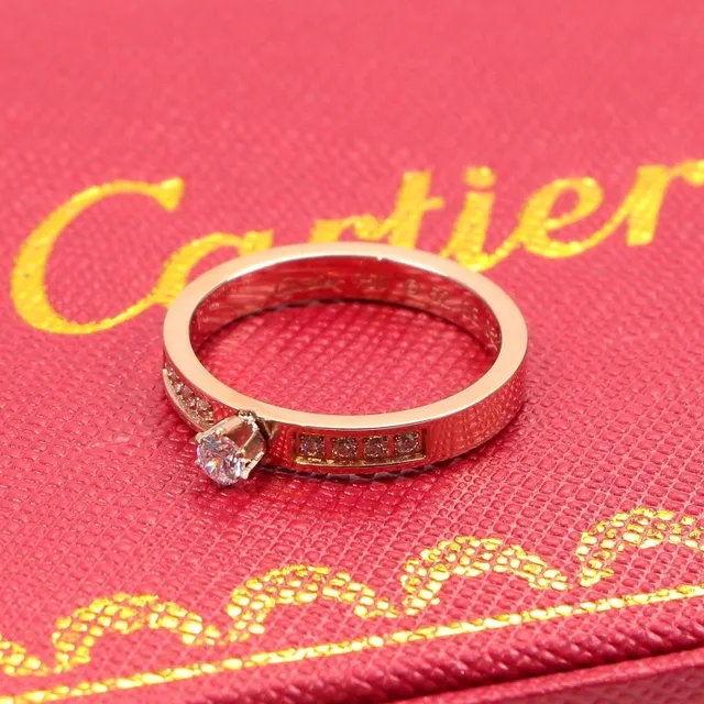Bague Cartier en or rose à diamant solitaire sertie en canal 6