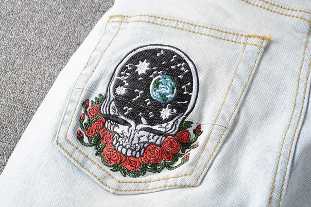 Distressed Light-Wash Patchwork Embroidered Bear Motif Jeans 18