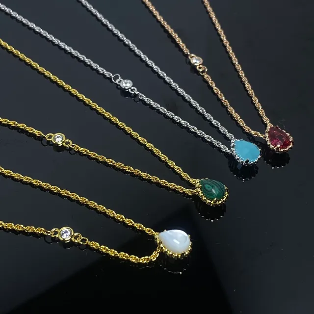 Gold and Silver Tone Single-Stone Teardrop Pendant Necklaces 3