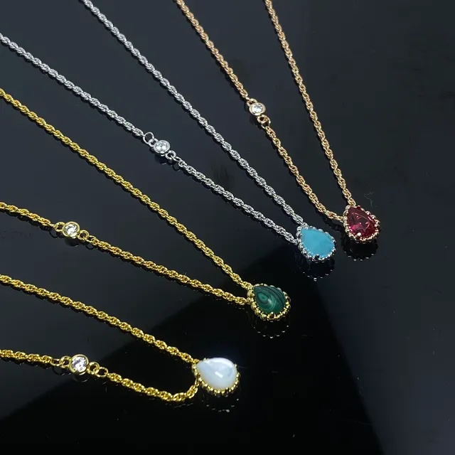 Gold and Silver Tone Single-Stone Teardrop Pendant Necklaces 4