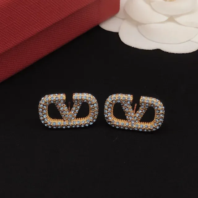 Gold-Tone Pave Light Blue Crystal Interlocking Loop Stud Earrings 2