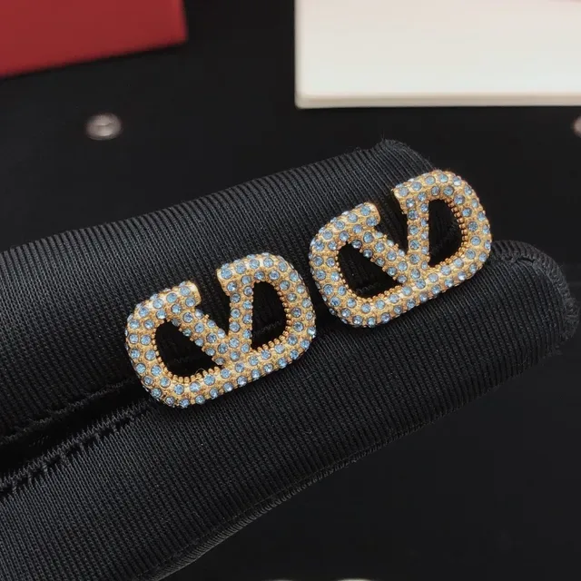 Gold-Tone Pave Light Blue Crystal Interlocking Loop Stud Earrings 9