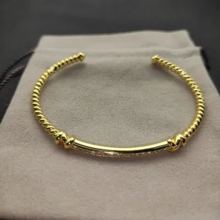 Pulsera abierta de cable trenzado dorado