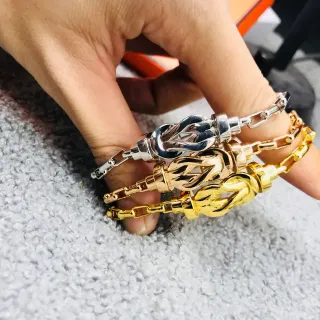 Pulseras Cadena Eslabones con Charme Nudo en Plata y Oro