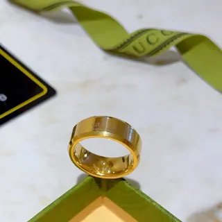 Gucci Engraved Logo Wide Band Gold-Tone Ring