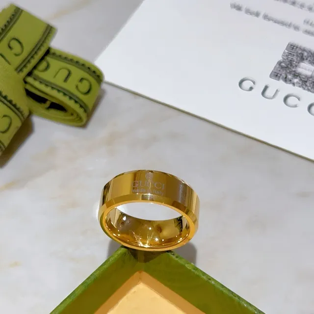 Gucci Engraved Logo Wide Band Gold-Tone Ring 7