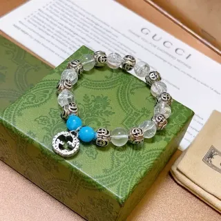 سوار Gucci GG Marmont أزرق شفاف Interlocking G Charms خرز كريستال وتركواز