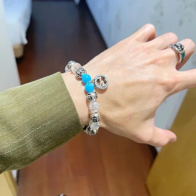 سوار Gucci GG Marmont أزرق شفاف Interlocking G Charms خرز كريستال وتركواز 3