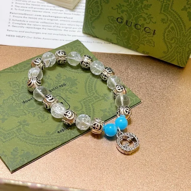 سوار Gucci GG Marmont أزرق شفاف Interlocking G Charms خرز كريستال وتركواز 4