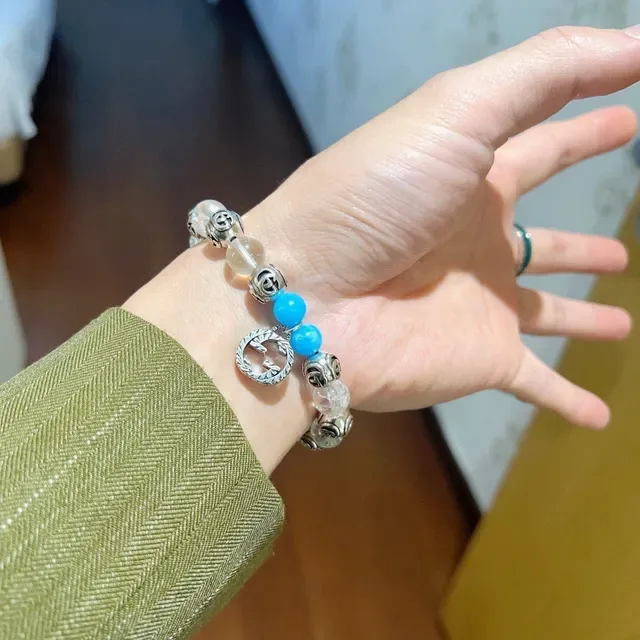 سوار Gucci GG Marmont أزرق شفاف Interlocking G Charms خرز كريستال وتركواز 5