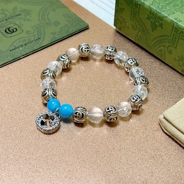 سوار Gucci GG Marmont أزرق شفاف Interlocking G Charms خرز كريستال وتركواز 6