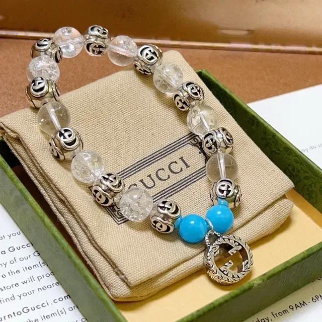 سوار Gucci GG Marmont أزرق شفاف Interlocking G Charms خرز كريستال وتركواز 7
