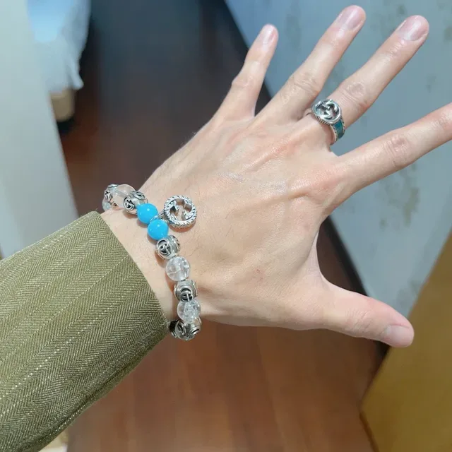 سوار Gucci GG Marmont أزرق شفاف Interlocking G Charms خرز كريستال وتركواز 8