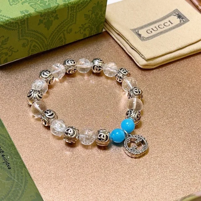 سوار Gucci GG Marmont أزرق شفاف Interlocking G Charms خرز كريستال وتركواز 9