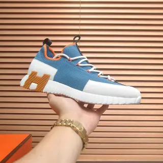 Hermès Zapatillas chunky upper em knit azul e laranja com midsole H esculpido