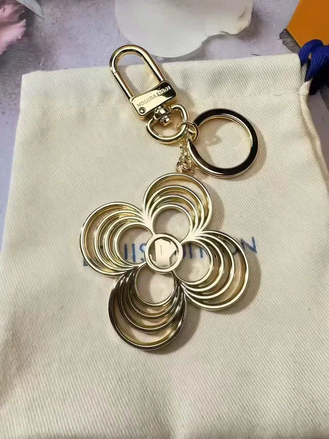 Louis Vuitton Flower Key Holder Gold Metal Quatrefoil Floral Motif Bracelet 2