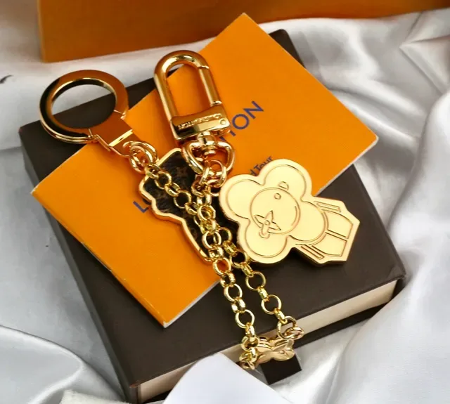 Louis Vuitton Monogram Flower and Vivienne Bear Gold Metal Engraved Phone Case 4