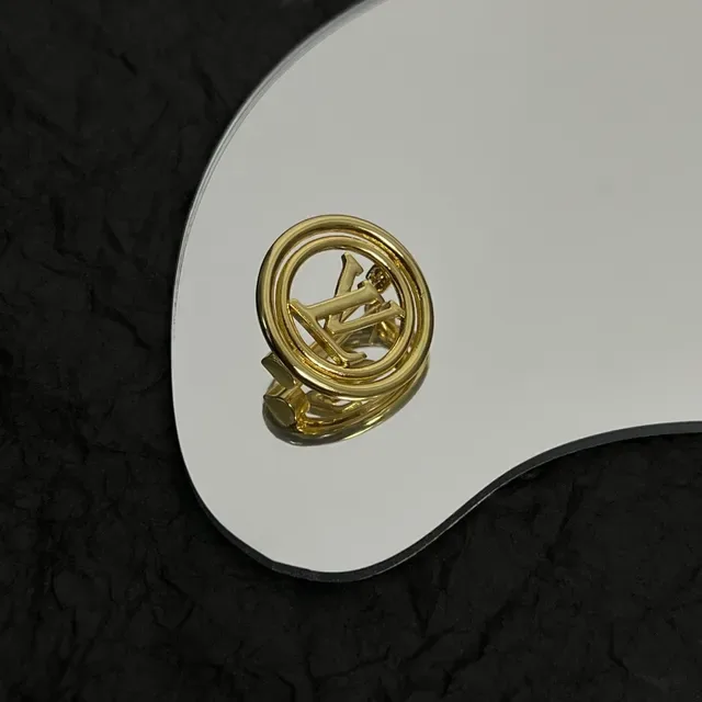 Louis Vuitton Monogrammed Gold-Tone Circular Brooch 4